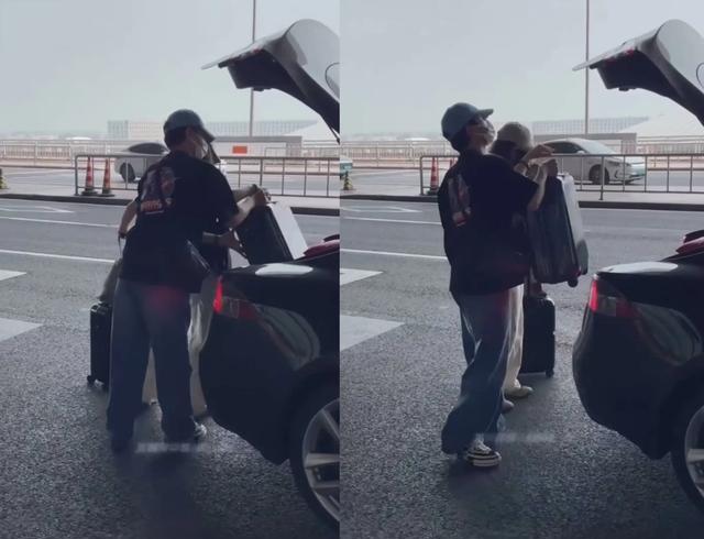 张晚意亲自拉行李箱